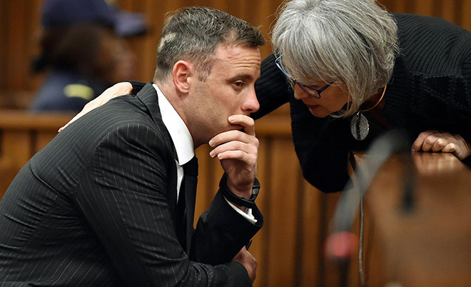 Former Paralympian Oscar Pistorius is comforted by an unidentified woman before his sentencing for the murder of Reeva Steenkamp at the Pretoria High Court, South Africa June 13, 2016. (AFP)