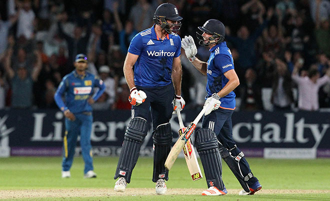 England's Liam Plunkett (left) celebrates with England's Chris Woakes after Plunkett hits a six off the final ball to draw the first one day international (ODI) cricket match between England and Sri Lanka at Trent Bridge cricket ground in Nottingham, central England, on June 21, 2016.  (AFP)