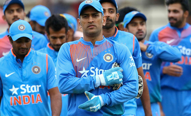 India captain Mahendra Singh Dhoni leads his team after victory during the third and final T20 cricket match in a series of three games between India and Zimbabwe in the Prayag Cup at Harare Sports Club, on June 22, 2016. (AFP)