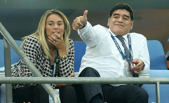 Diego Maradona and his girlfriend Rocio Oliva attend the UEFA Euro 2016 Group A opening match between France and Romania at Stade de France on June 10, 2016 in Saint-Denis near Paris, France. (Getty Images)