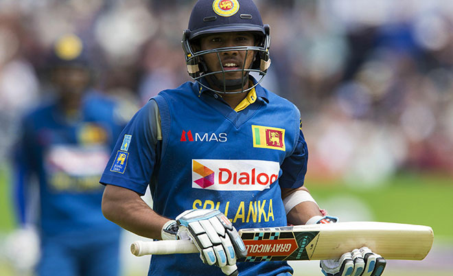 Sri Lanka's Kusal Mendis leaves the field after losing his wicket for 53 runs to England's Alex Hales, off the bwling of England's Liam Plunkett, during play in the third one day international (ODI) cricket match between England and Sri Lanka at Bristol cricket ground in Bristol, south-west England, on June 26, 2016. (AFP)