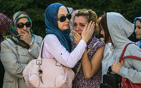 Relatives of suicide attack victim Mohammad Eymen Demirci mourn on June 29, 2016 in Istanbul during his funeral a day after a suicide bombing and gun attack targeted Istanbul's Ataturk airport, killing 41 people.  Turkey pointed the finger of blame at Islamic State jihadists on June 29 after suicide bombers armed with automatic rifles attacked Istanbul's main international airport, killing 41 people, including foreigners. / AFP