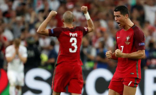 Portugal's Cristiano Ronaldo celebrates after Poland's Jakub Blaszczykowski misses during the penalty shootout. (Reuters)
