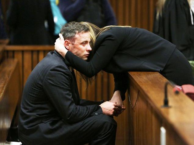 Oscar Pistorius is seen with sister Aimee during the proceedings of his resentencing hearing for the 2013 murder of his girlfriend Reeva Steenkamp in the North Gauteng High Court in Pretoria. (Reuters)