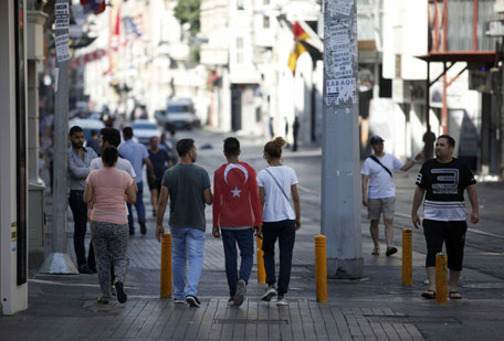People walk in the streets near Taksim Square in Istanbul after an attempted coup in Turkey, July 16, 2016. (Reuters)