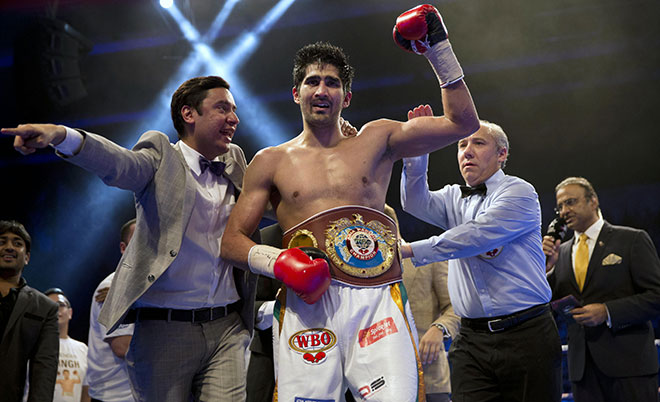 Indian boxer Vijender Singh reacts after wining WBO Asia Pacific Super Middleweight title against Australia’s Kerry Hope in New Delhi, India, Saturday, July 16, 2016. (AP)