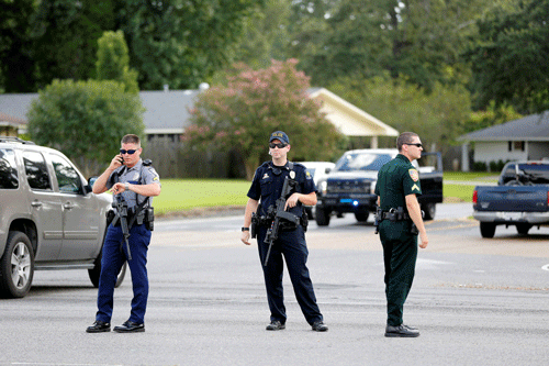 Police officers block off a road after a shooting of police in Baton Rouge, Louisiana, U.S. July 17, 2016.  REUTERS