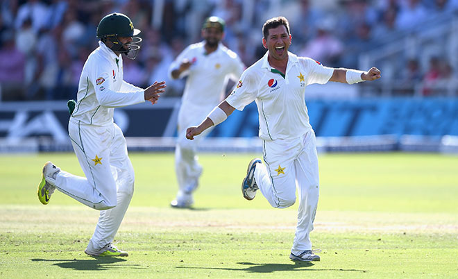 Yasir Shah of Pakistan celebrates with Azhar Ali after dismissing Chris Woakes of England during day four of the 1st Investec Test between England and Pakistan at Lord's Cricket Ground on July 17, 2016 in London, England. (Getty Images)