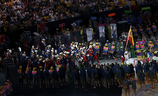 Flagbearer Rafael Nadal of Spain leads their contingent at the opening ceremony.  (Reuters)