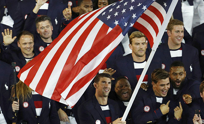 lagbearer Michael Phelps (USA) of United States of America leads his contingent during the opening ceremony. (Reuters)