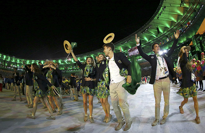 Brazil arrive in the stadium for the opening ceremony. (Reuters)