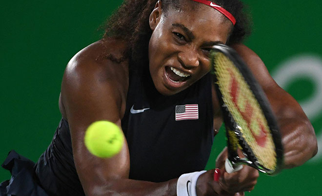 USA's Serena Williams returns the ball to France's Alize Cornet during their women's second round singles tennis match at the Olympic Tennis Centre of the Rio 2016 Olympic Games in Rio de Janeiro on August 8, 2016.(AFP)