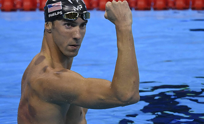 USA's Michael Phelps celebrates after he won the Men's 200m Butterfly Final during the swimming event at the Rio 2016 Olympic Games at the Olympic Aquatics Stadium in Rio de Janeiro on August 9, 2016. (AFP)
