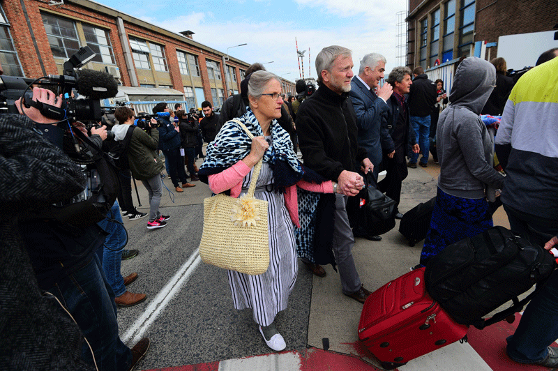 In this file photo, passengers being evacuated from Brussels airport, on March 22, 2016 in Zaventem, after twin blasts rocked the main terminal of Brussels airport. (AFP)