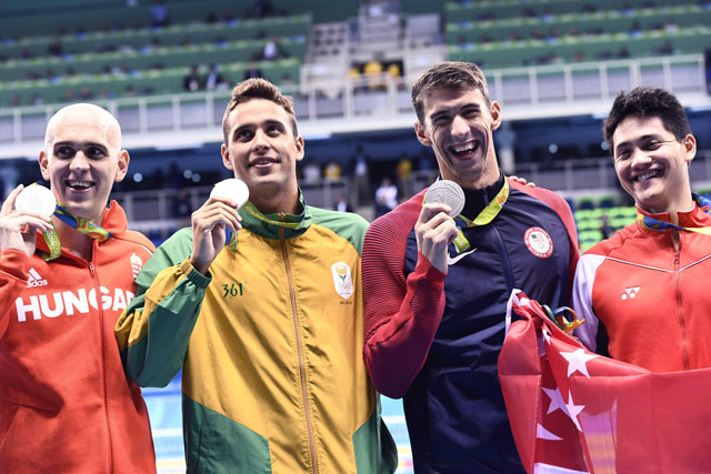 Singapore's Schooling Joseph (2ndR) poses with silver medallists (fromL) USA's Michael Phelps, Hungary's Laszlo Cseh and South Africa's Chad Guy Bertrand Le Clos after he won the Men's 100m Butterfly Final during the swimming event at the Rio 2016 Olympic Games at the Olympic Aquatics Stadium in Rio de Janeiro on August 12, 2016. (AFP)