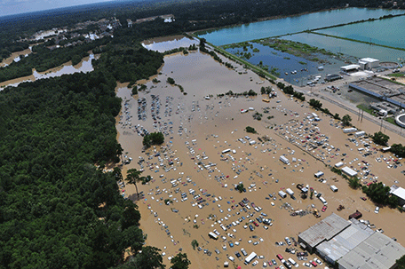In this August 15, 2016 US Coast Guard handout photo, flooded areas of Baton Rouge, Louisiana, are seen from the air.  As many as 30,000 people have been rescued following unprecedented floods in the southern US state of Louisiana, including a 78-year-old woman who spent a night stranded in a tree, police said late Monday. Residents awoke August 16 to find their homes and businesses still surrounded by muddy water, without clear answers about when the epic flooding that has killed at least seven is expected to recede.(AFP)