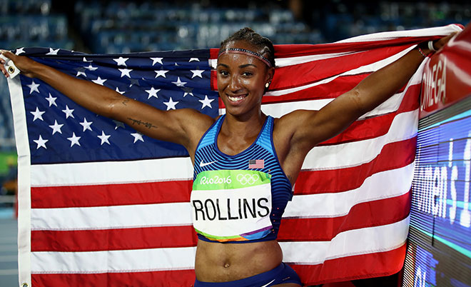 Brianna Rollins of the United States celebrates with the American flag after winning the gold medal in the Women's 100m Hurdles Final on Day 12 of the Rio 2016 Olympic Games at the Olympic Stadium on August 17, 2016 in Rio de Janeiro, Brazil. (Getty Images)