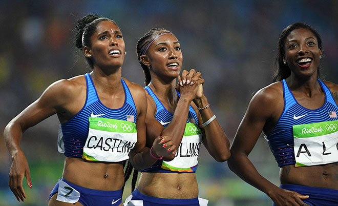 USA's Kristi Castlin, USA's Brianna Rollins and USA's Nia Ali celebrate after finishing respectively third first and second in the Women's 100m Hurdles Final during the athletics event at the Rio 2016 Olympic Games at the Olympic Stadium in Rio de Janeiro on August 17, 2016. (AFP)