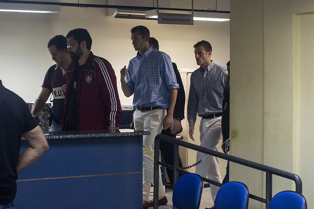 U.S Olympic swimmers Gunnar Bentz and Jack Conger are seen leaving the police station after questioning in Rio de Janiero, Brazil. (Getty Images)