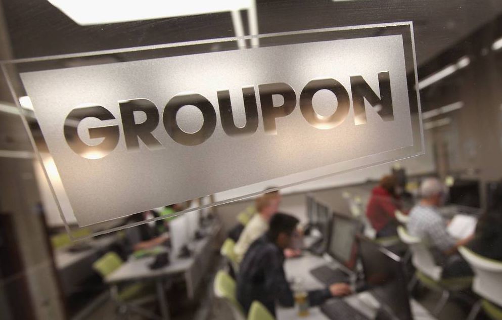 Groupon buys rival LivingSocial after reporting loss Business