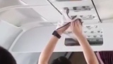 Photo: Woman drys underwear on plane air vents
