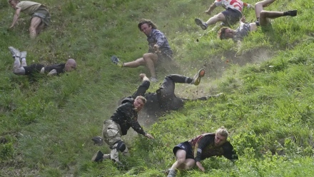Photo: Rolling thunder: Contestants chase cheese wheel down a hill in chaotic UK race