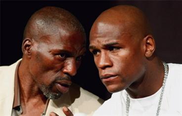 Roger Mayweather, left, has tipped Floyd to win in Las Vegas tomorrow. (AFP)